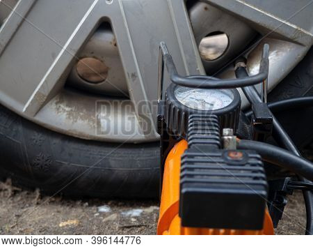 Pump Up The Autowheel Compressor On The Road. Car Electro Pump.