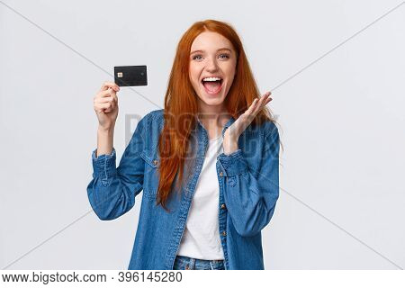 Charismatic Happy Good-looking Redhead Female Student In Casual Clothes, Holding Credit Card With Be