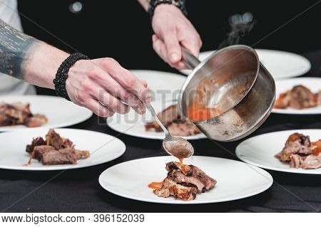 Chief Serving Homemade Bone-in Prime Rib Roast On A White Plate
