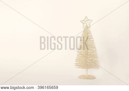 Christmas Composition. Golden Christmas Tree Decoration With Glitters On Set Sail Champagne (color O