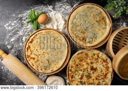 Three Types Of Classic Unleavened Wheat Flatbread With Herbs And Cheese Made From Flour, Eggs, Onion