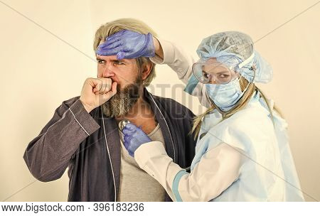 Diagnosis Of Pneumonia. Doctor Protective Equipment Examines Patient Suspected Coronavirus Infection