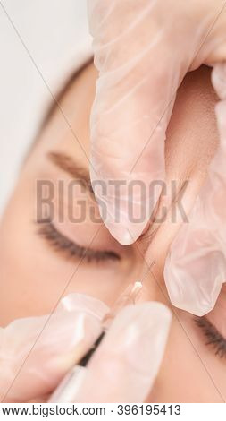 Forehead Injection At Spa Salon. Doctor Hands. Closeup. High Quality. Pretty Female Patient. Beauty 