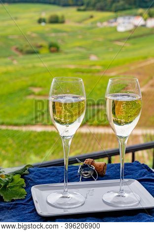 Tasting Of French Sparkling White Wine With Bubbles Champagne On Outdoor Terrace With View On Grand