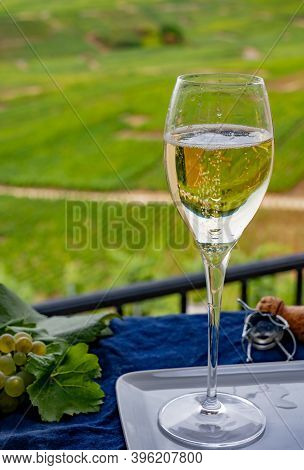 Tasting Of French Sparkling White Wine With Bubbles Champagne On Outdoor Terrace With View On Grand