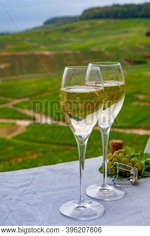 Tasting Of French Sparkling White Wine With Bubbles Champagne On Outdoor Terrace With View On Grand