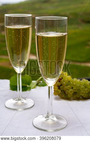 Tasting Of French Sparkling White Wine With Bubbles Champagne On Outdoor Terrace With View On Grand