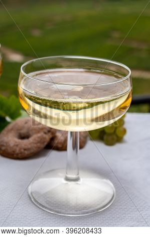 Tasting Of French Sparkling White Wine With Bubbles Champagne On Outdoor Terrace With View On Grand