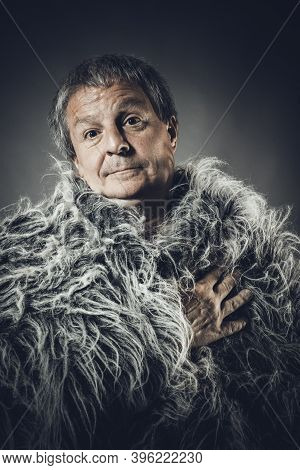 Solid Middle-aged Man In A Fur Mantle