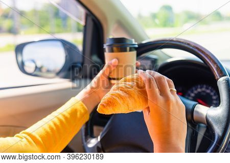 Asian Woman Eating Food Fastfood And Drink Coffee While Driving The Car In The Morning During Going 