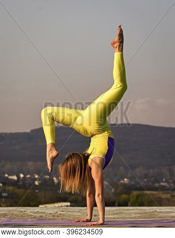 You Just Get Strong. Flexible Girl Outdoor. Woman Practicing Yoga. Stretching Muscles. Fitness Train