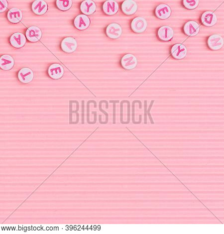 Alphabet beads border pink wallpaper background