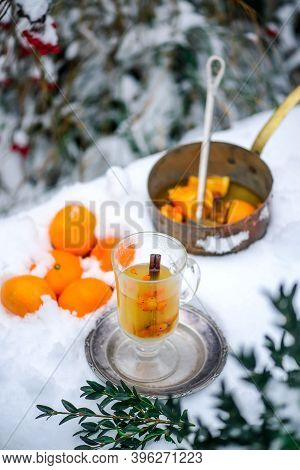 Mulled Wine With Sea Buckthorn And Mandrins In The Winter Garden Selective Focus