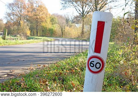 Small Pole At The Side Of The Road Reminding To Max At 60 Kph, Selective Focus