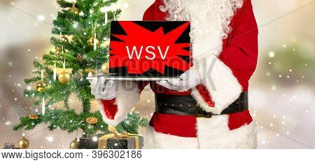 Santa Makes Advertising With A Laptop For The Winter Sales In Germany With The Inscription Wsv
