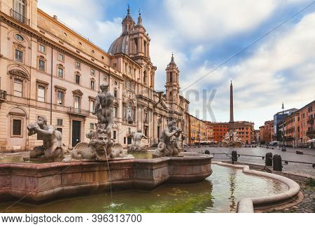 Piazza Navona, a significant example of Baroque Roman architecture in Rome with Fontana del Moro (Moor Fountain) in foreground and Fontana dei Quattro Fiumi (Fountain of the Four Rivers) in background