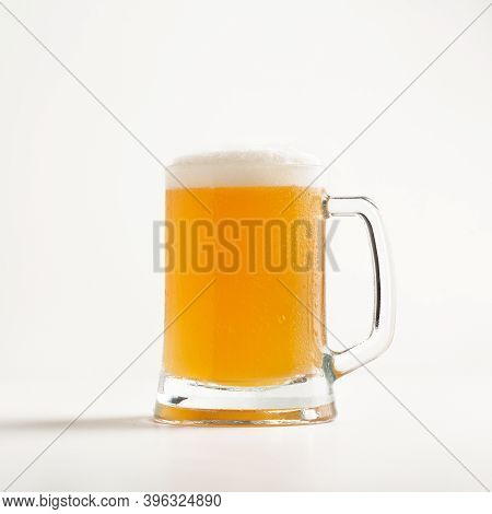 Lager, Ale, Beer Advertising And Most Popular Drink In Pub In Evening. Cold Glass Mug Of Light Beer 