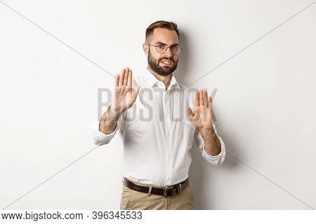 Displeased Man Rejecting Something Disturbing, Showing Stop Sign And Declining, Cringe From Aversion