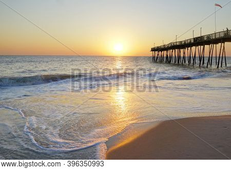 Avalon Pier And Sandy Beach At The Outer Banks Of North Carolina At Sunrise
