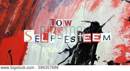 Cut Out Of Letters Magazines Compiled The Word Low Self-esteem On An Abstract Colorful Background