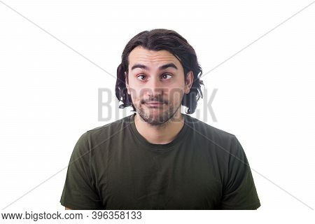 Portrait Of Silly Young Man, Curly Hair Style, Makes Funny Dumb Faces With Crossed Eyes. Body Langua