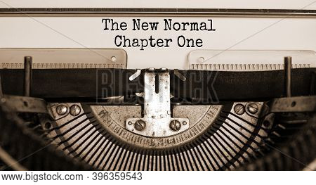 Time For A New Normal. Text 'the New Normal, Chapter One' Typed On Retro Typewriter. Business And Po