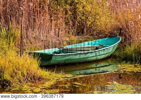 Autumn Sunny Day And A Boat In The Reeds. Leningrad Region. Russia. September 2020
