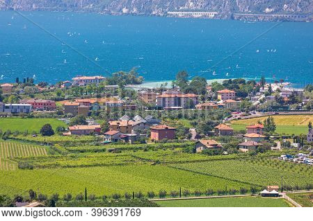 Nago Torbole, Italy - June 13, 2019: Green Fields And Garda Lake In Nago Torbole, Italy.