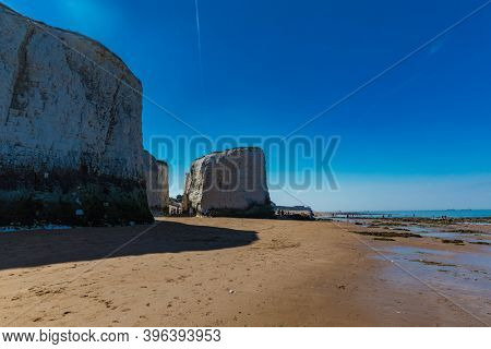 MARGATE, Kent, UK: 21 May 2020: Visitors to Margate's Main Sands beach surrounded by white cliffs during the heatwave in Britain.