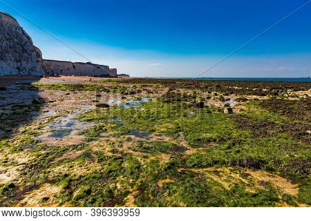 MARGATE, Kent, UK: 21 May 2020: Visitors to Margate's Main Sands beach surrounded by white cliffs during the heatwave in Britain.