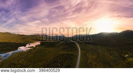 Picturesque Panoramic View Of Scenic Highway Surrounded By Golden Rocky Mountains At Sunset In Canad