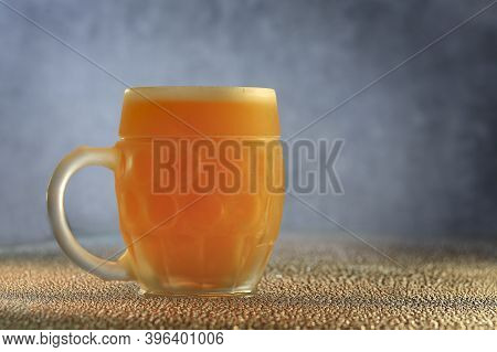 Weizen Beer On The Ftozen Glass Table With Water Drops. Dark Background.
