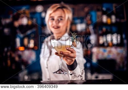 Girl Barman Concocts A Cocktail In The Saloon
