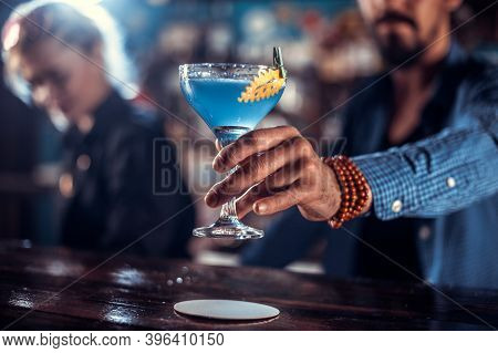 Barman Formulates A Cocktail At The Bar