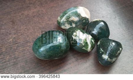 Moss Agates, Polished Tumbled Stones. Green Colour Stones With Patches Of White In Between Form Of S