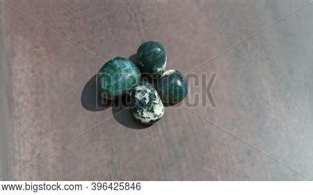 Moss Agates, Polished Tumbled Stones. Green Colour Stones With Patches Of White In Between Form Of S