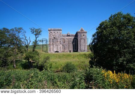 Hermitage Castle Is A Half-ruined Castle On Hermitage Water, Located In The Scottish Borders Area Of