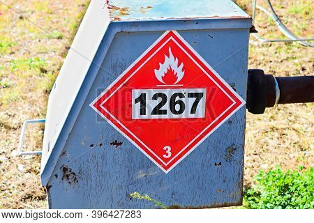 A Red Hazard 1267 Petroleum Crude Oil Sign