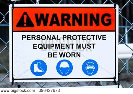 A Warning Personal Proctective Equipement Must Be Worn Sign