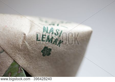 Shallow Depth Of Field Focus On Nasi Lemak Bungkus (packed Fragrance Rice) National Breakfast Dish O