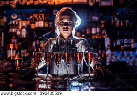 Girl Bartender Concocts A Cocktail At The Porterhouse