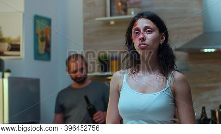 Traumatised Woman Looking At Knife While The Drunk Man Screaming In The Back. Violent Aggressive Hus
