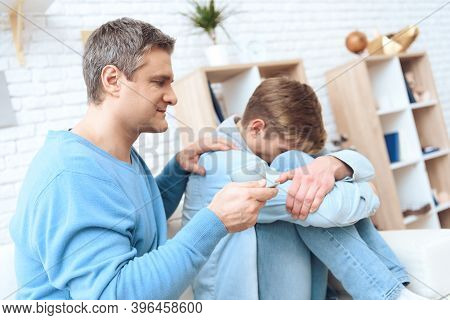 Father Tries To Comfort His Son With Coffee, But Problem Teenager Turning Away.