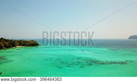 Turquoise Clear Water. Yachts, Boats Floating. Water Gradient From Light To Dark Blue. Phi Phi Don I