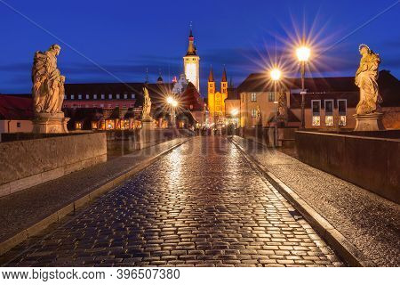 Old Main Bridge, Alte Mainbrucke With Statues Of Saints, Cathedral And City Hall In Old Town Of Wurz