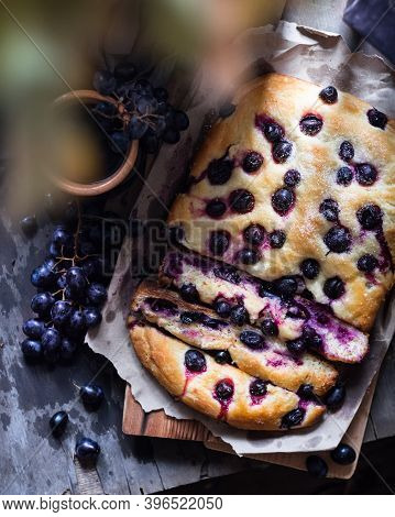 Florentine Grape Bread Schiacciata Con L Uva, A Sweet Focaccia Typical Of Tuscany. Top View, Wooden 
