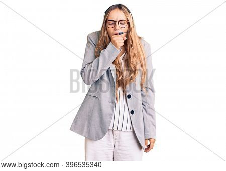 Young beautiful blonde woman wearing call center agent headset feeling unwell and coughing as symptom for cold or bronchitis. health care concept. 