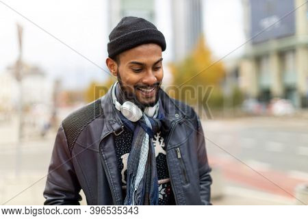 Portrait of a handsome young man on the city street 