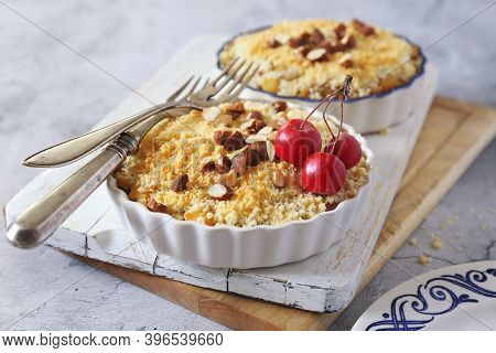 Apple Crumble With Almonds, Two Portions On Light Gray Background, Red Paradise Apples Dressing