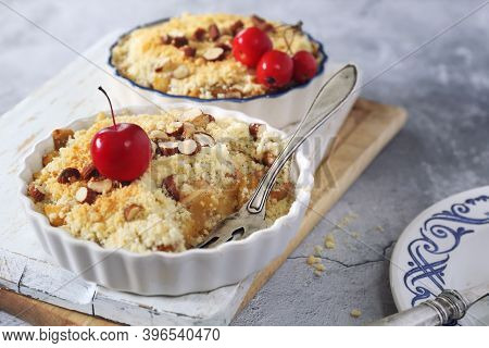 Apple Crumble With Almonds, Two Portions On Light Gray Background, Red Paradise Apples Dressing
